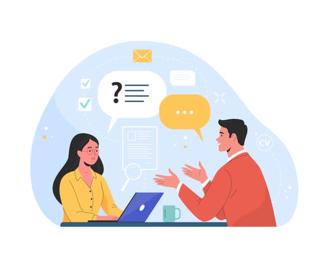 man talking to a young woman with laptop